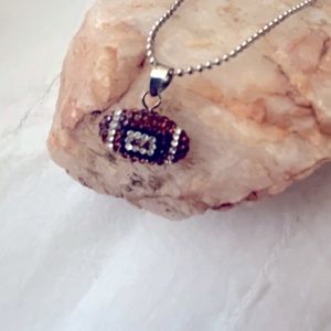 Swarovski football crystal sterling silver pendent.
